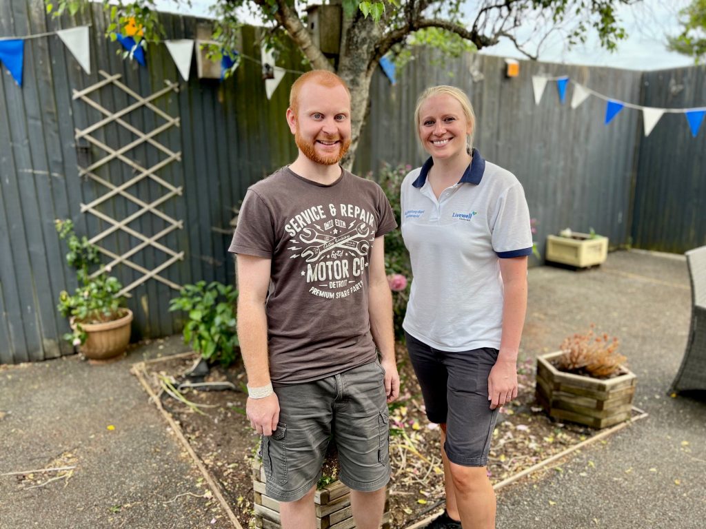 Josh and physiotherapist Alice in the Plym Neuro Rehab Unit garden