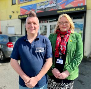 Jonathan and Emma outside his shop in Plymouth