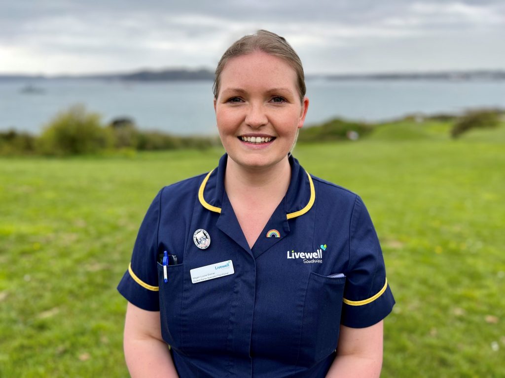 Megan in blue nurse uniform