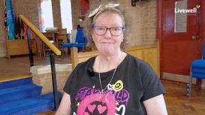 Woman with glasses smiling