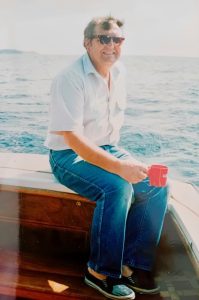 Man in a boat wearing sunglasses