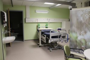 En-suite hospital room with bed