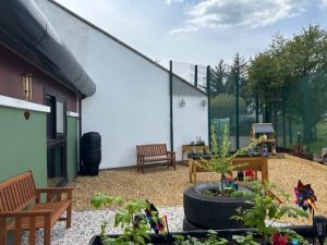 Colourful garden with plants, tree, raised beds and seating