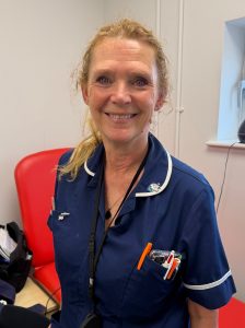 Woman in blue nurse uniform
