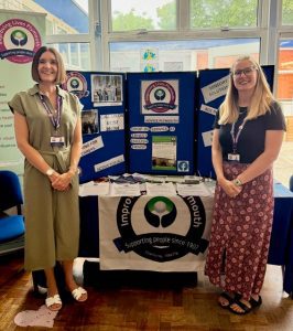 Two women stood either side of an information stand