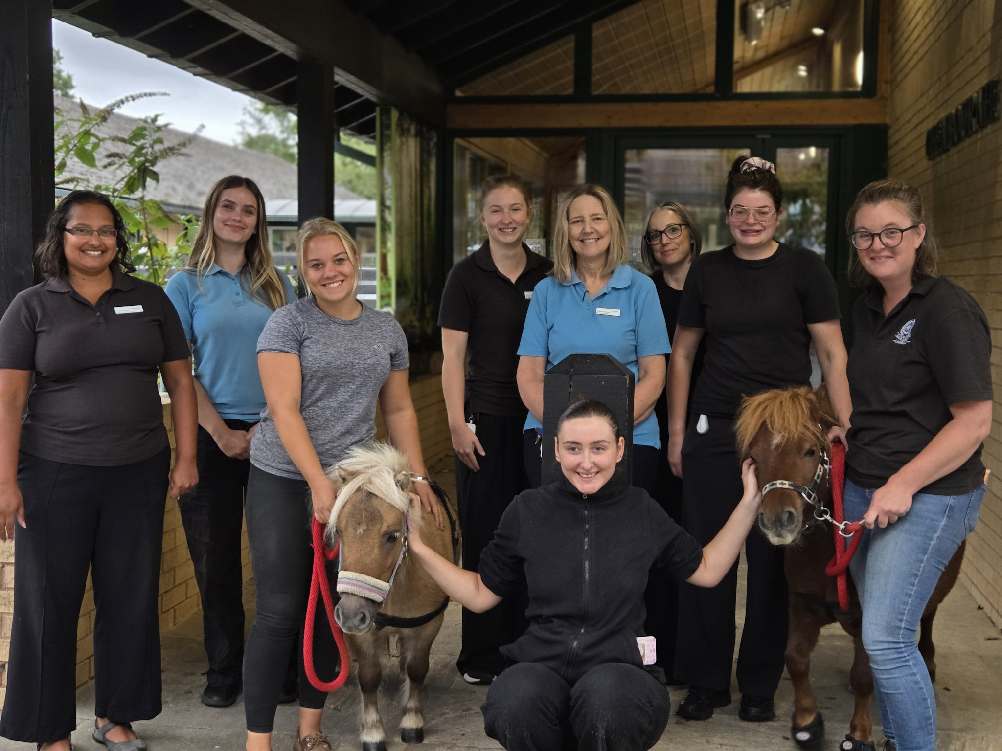 Glenbourne team and Ponies Staff from the Glenbourne Unit pictured with Peanut and Whizzle the ponies and their owners Charlotte and Ruby from Dartmoor Carriages.